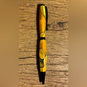 Beautiful hand turned acrylic ink pen. Smooth writing black ink. Black accents.